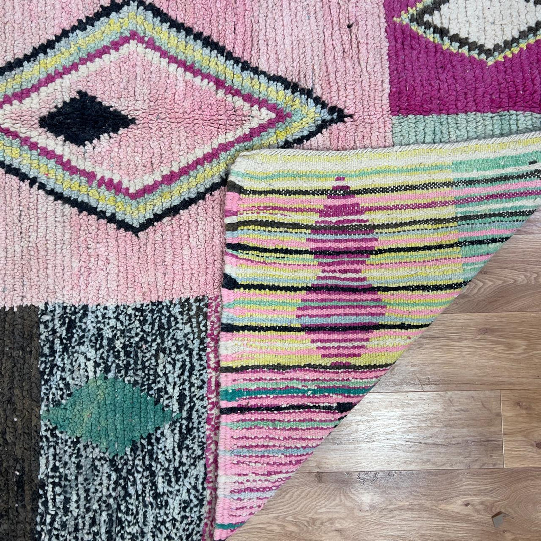 Vintage Moroccan wool rug 8.20 x 5.12 ft Rug 46 featuring central diamond motif with pastel patchwork design in pink, green, cream, and brown tones