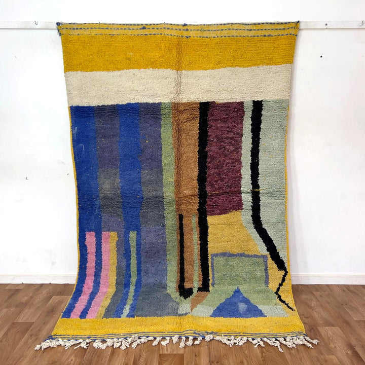 Vintage Moroccan wool rug 8.46 x 5.38 ft with abstract geometric design in blue yellow green and cream handmade Berber rug
