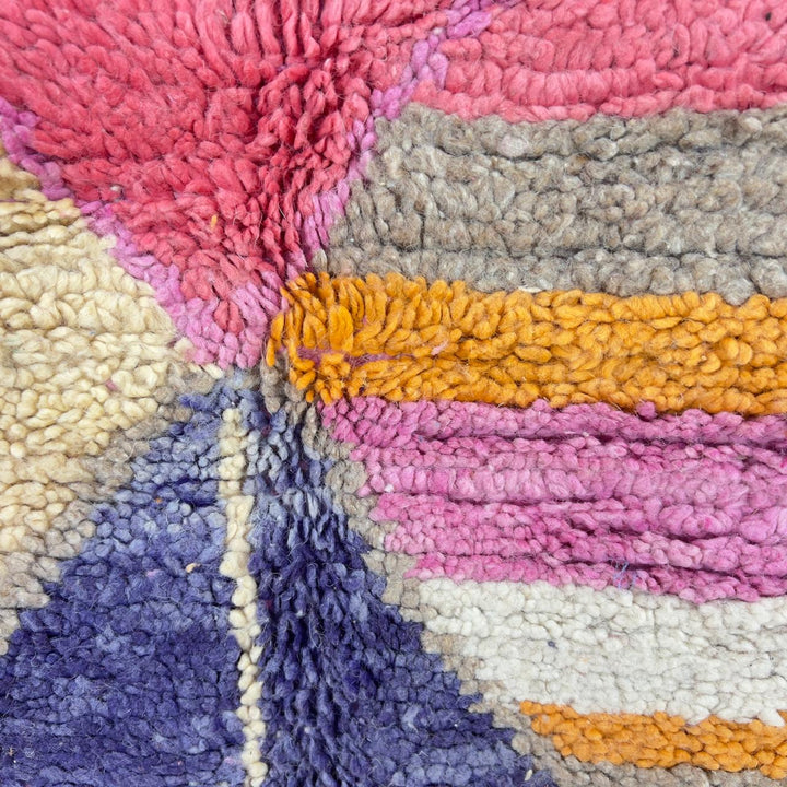Vintage Moroccan wool rug with colorful geometric diamonds and striped pattern in pink, orange and purple tones, handmade Berber rug