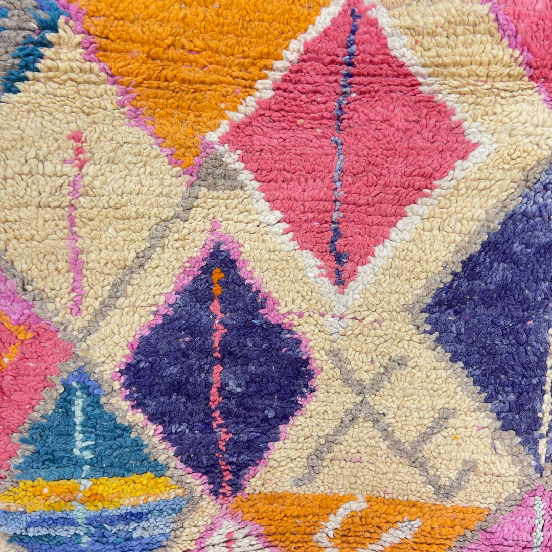 Vintage Moroccan wool rug with colorful geometric diamonds and striped pattern in pink, orange and purple tones, handmade Berber rug