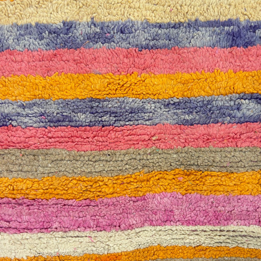 Vintage Moroccan wool rug with colorful geometric diamonds and striped pattern in pink, orange and purple tones, handmade Berber rug