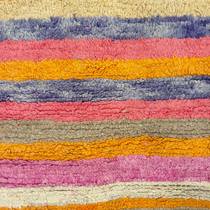 Vintage Moroccan wool rug with colorful geometric diamonds and striped pattern in pink, orange and purple tones, handmade Berber rug