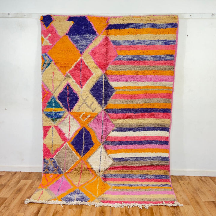 Vintage Moroccan wool rug with colorful geometric diamonds and striped pattern in pink, orange and purple tones, handmade Berber rug