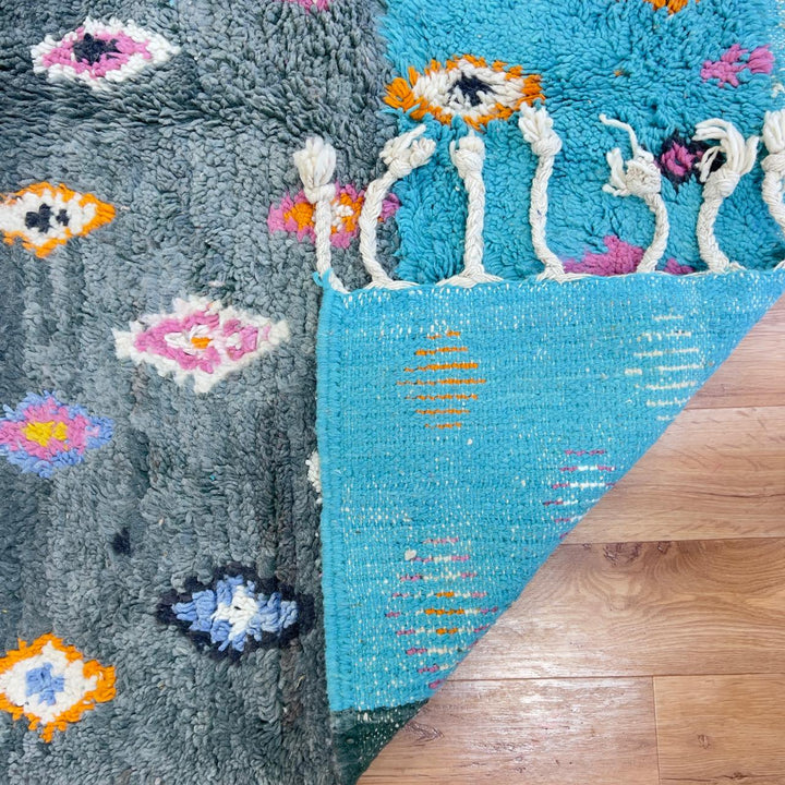 Vintage Moroccan wool rug with colorful diamond patterns on grey background and turquoise border handmade Berber carpet