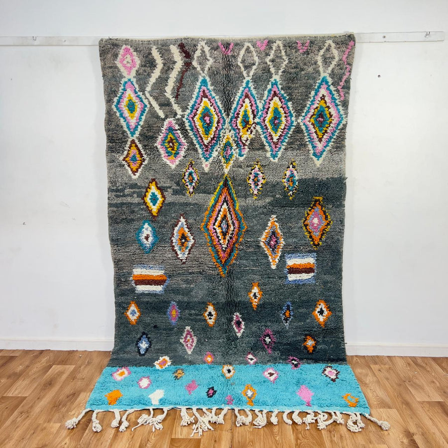 Vintage Moroccan wool rug with colorful diamond patterns on grey background and turquoise border handmade Berber carpet