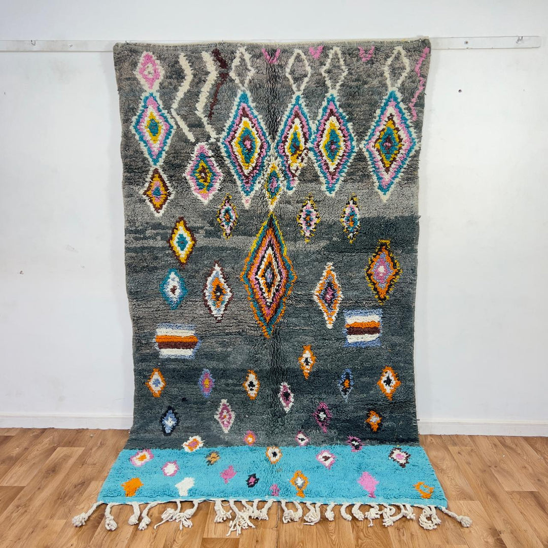 Vintage Moroccan wool rug with colorful diamond patterns on grey background and turquoise border handmade Berber carpet