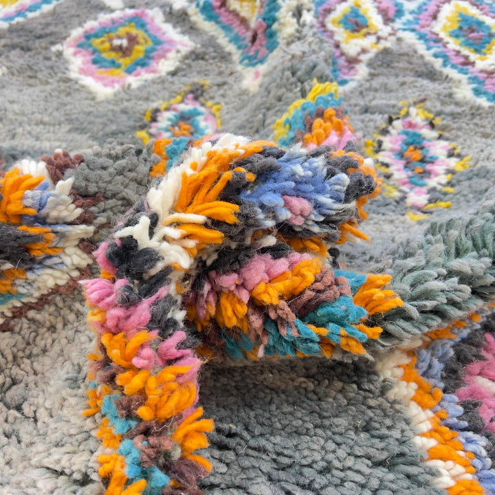 Vintage Moroccan wool rug with colorful diamond patterns on grey background and turquoise border handmade Berber carpet