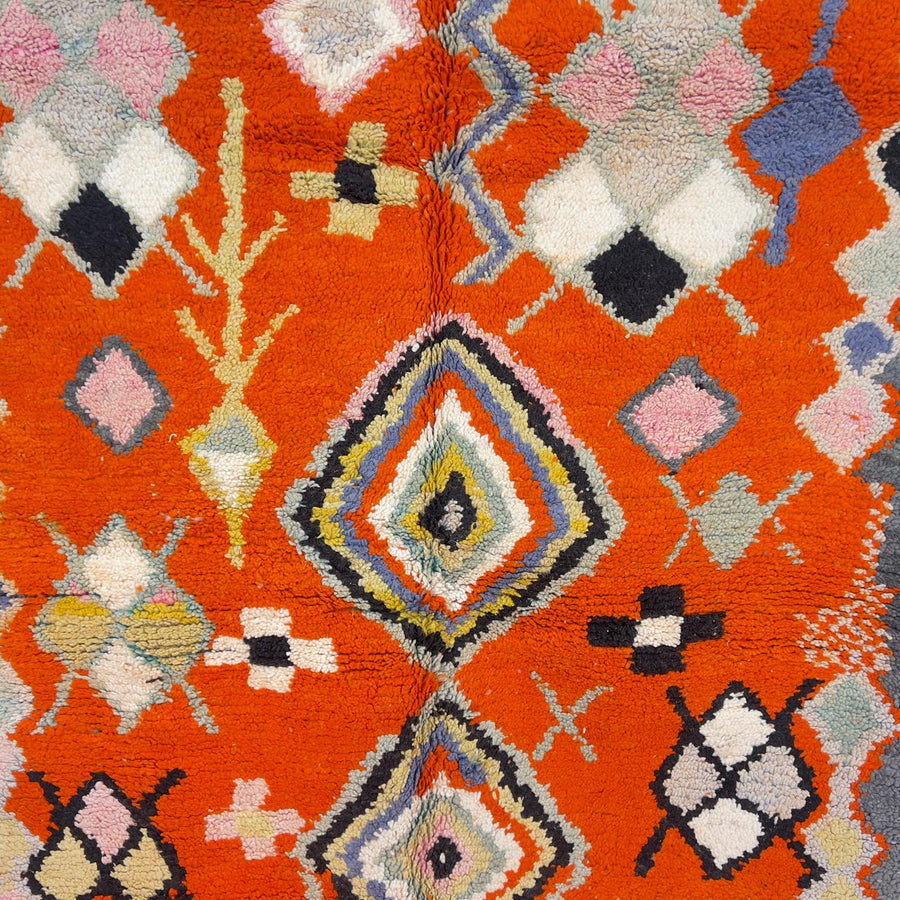Vintage Moroccan wool rug orange with tribal geometric patterns handmade Berber rug