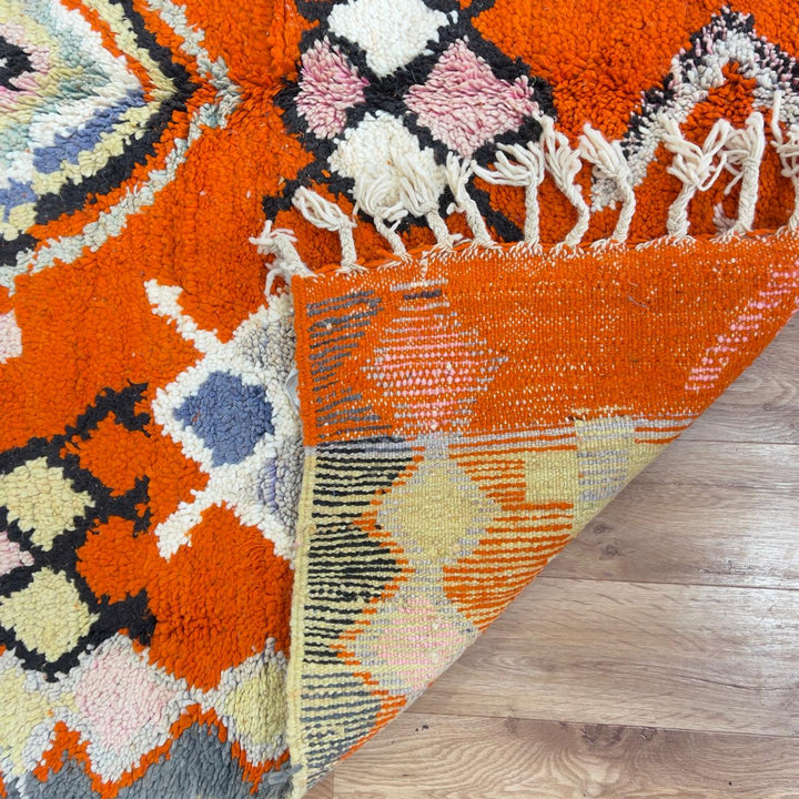 Vintage Moroccan wool rug orange with tribal geometric patterns handmade Berber rug