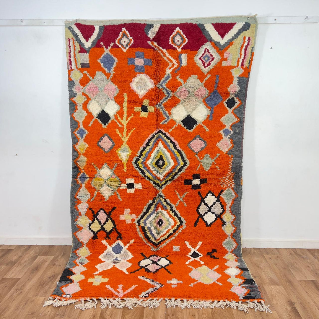 Vintage Moroccan wool rug orange with tribal geometric patterns handmade Berber rug
