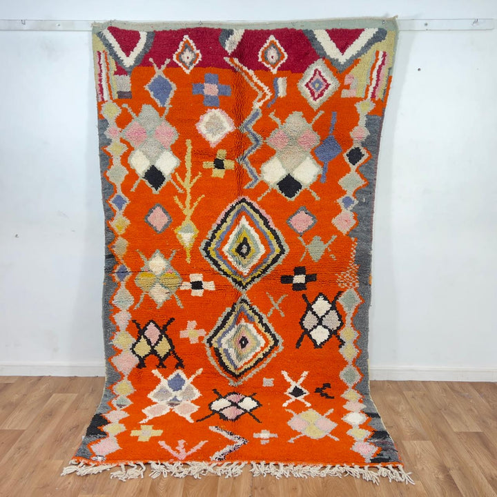 Vintage Moroccan wool rug orange with tribal geometric patterns handmade Berber rug