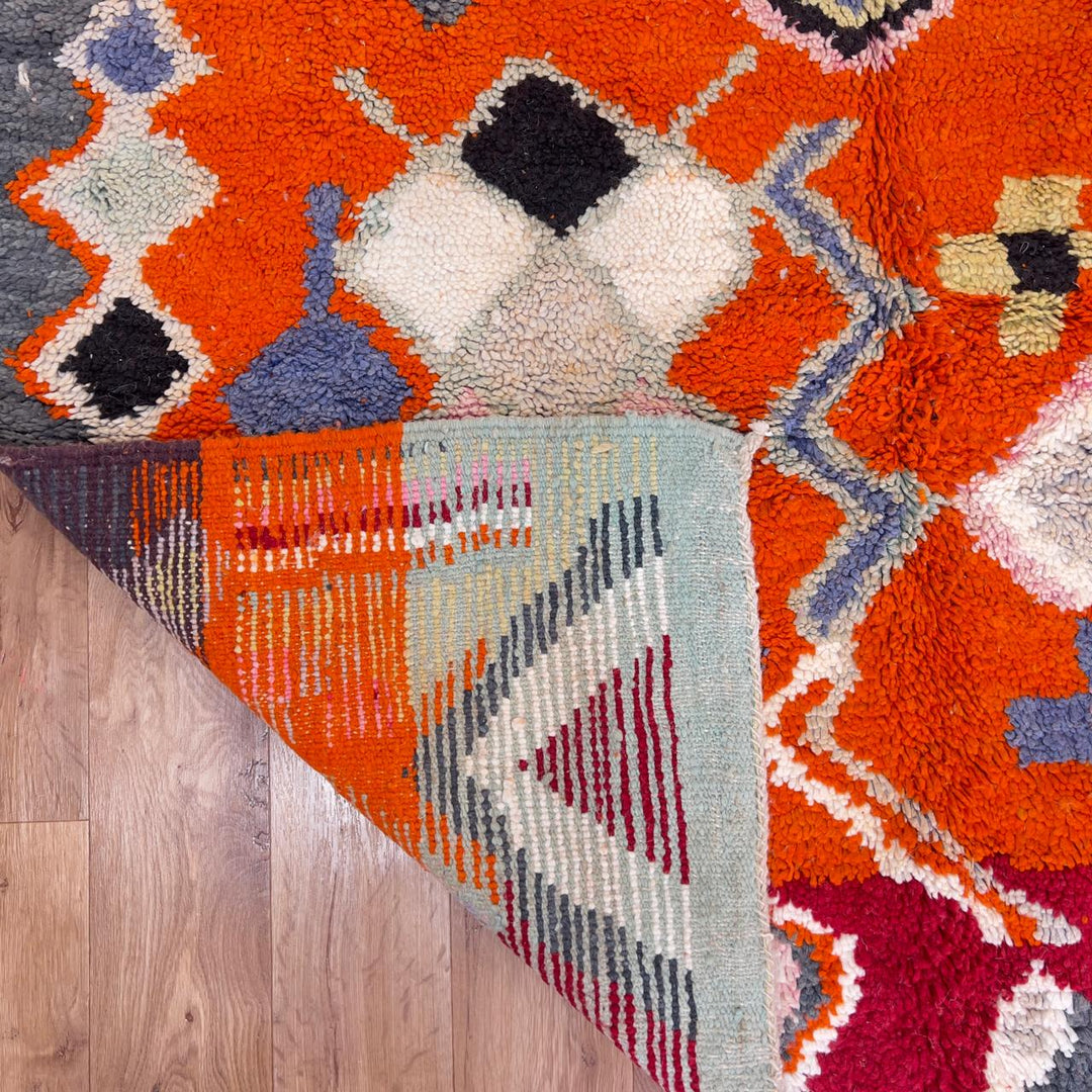 Vintage Moroccan wool rug orange with tribal geometric patterns handmade Berber rug