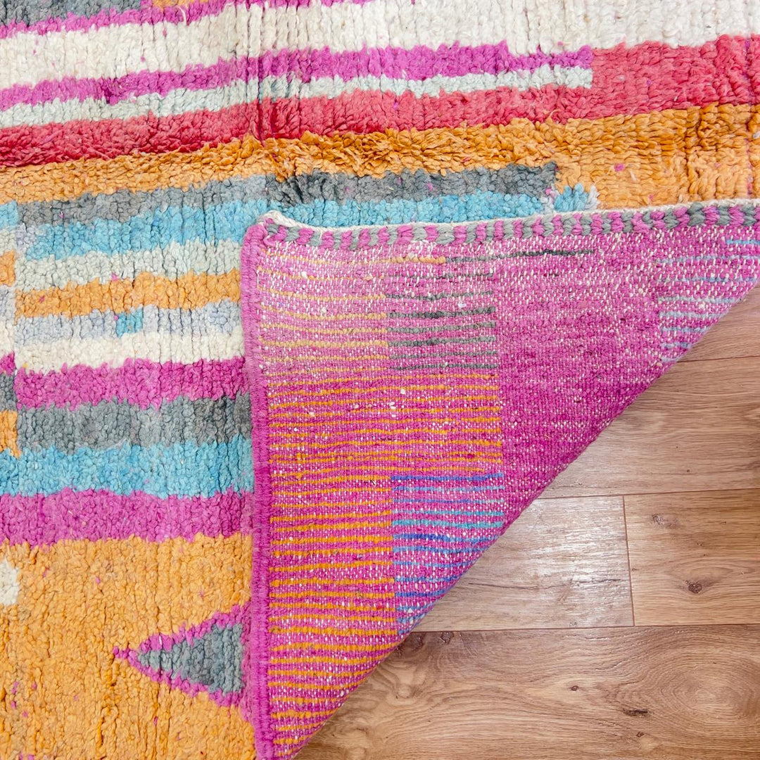 Vintage Moroccan wool rug with colorful abstract geometric pattern in pink, yellow and grey handmade Berber rug
