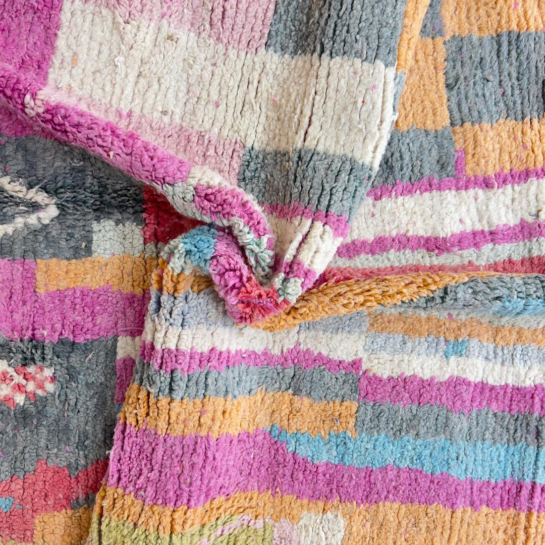 Vintage Moroccan wool rug with colorful abstract geometric pattern in pink, yellow and grey handmade Berber rug