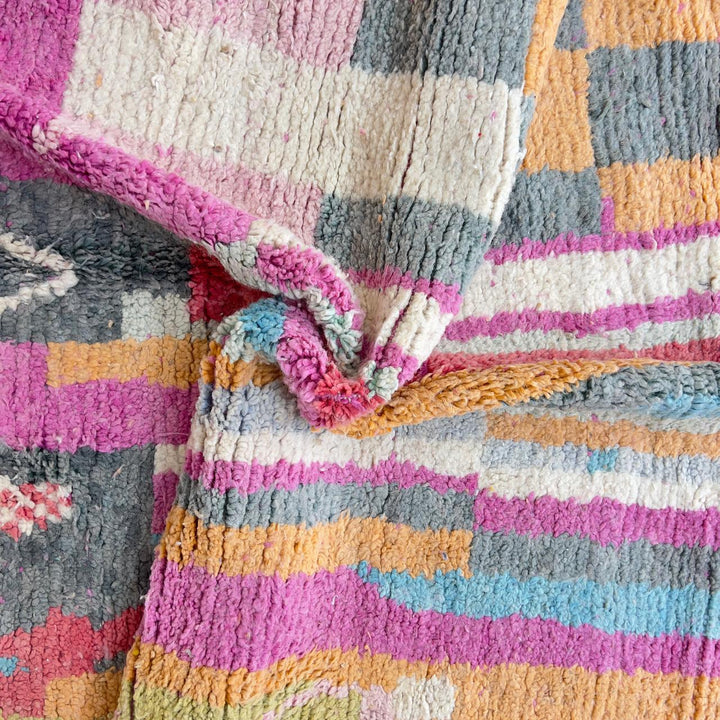 Vintage Moroccan wool rug with colorful abstract geometric pattern in pink, yellow and grey handmade Berber rug