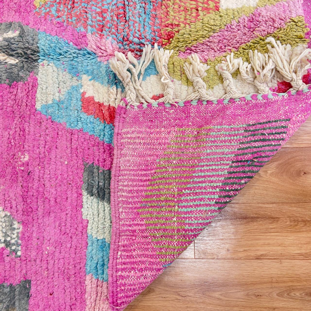 Vintage Moroccan wool rug with colorful abstract geometric pattern in pink, yellow and grey handmade Berber rug