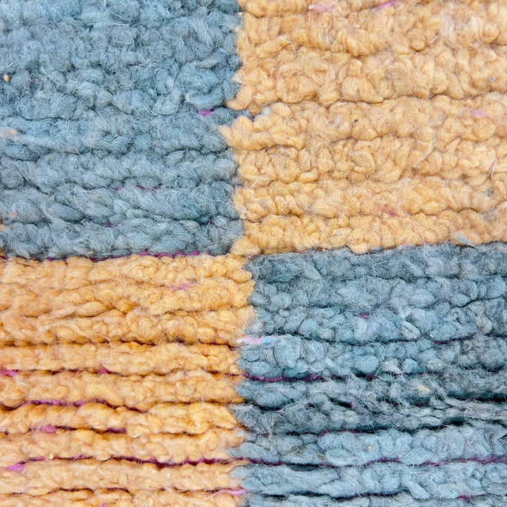 Vintage Moroccan wool rug with colorful abstract geometric pattern in pink, yellow and grey handmade Berber rug