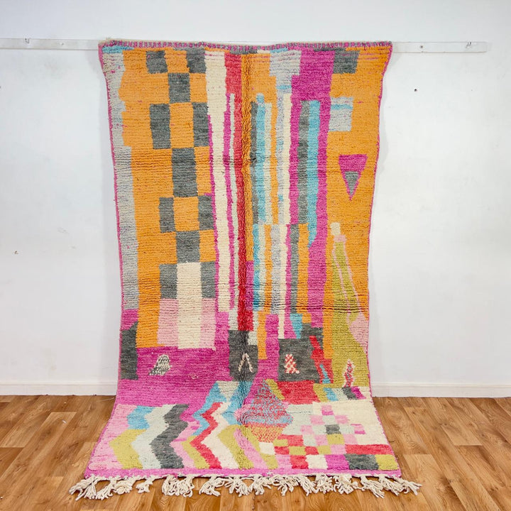 Vintage Moroccan wool rug with colorful abstract geometric pattern in pink, yellow and grey handmade Berber rug