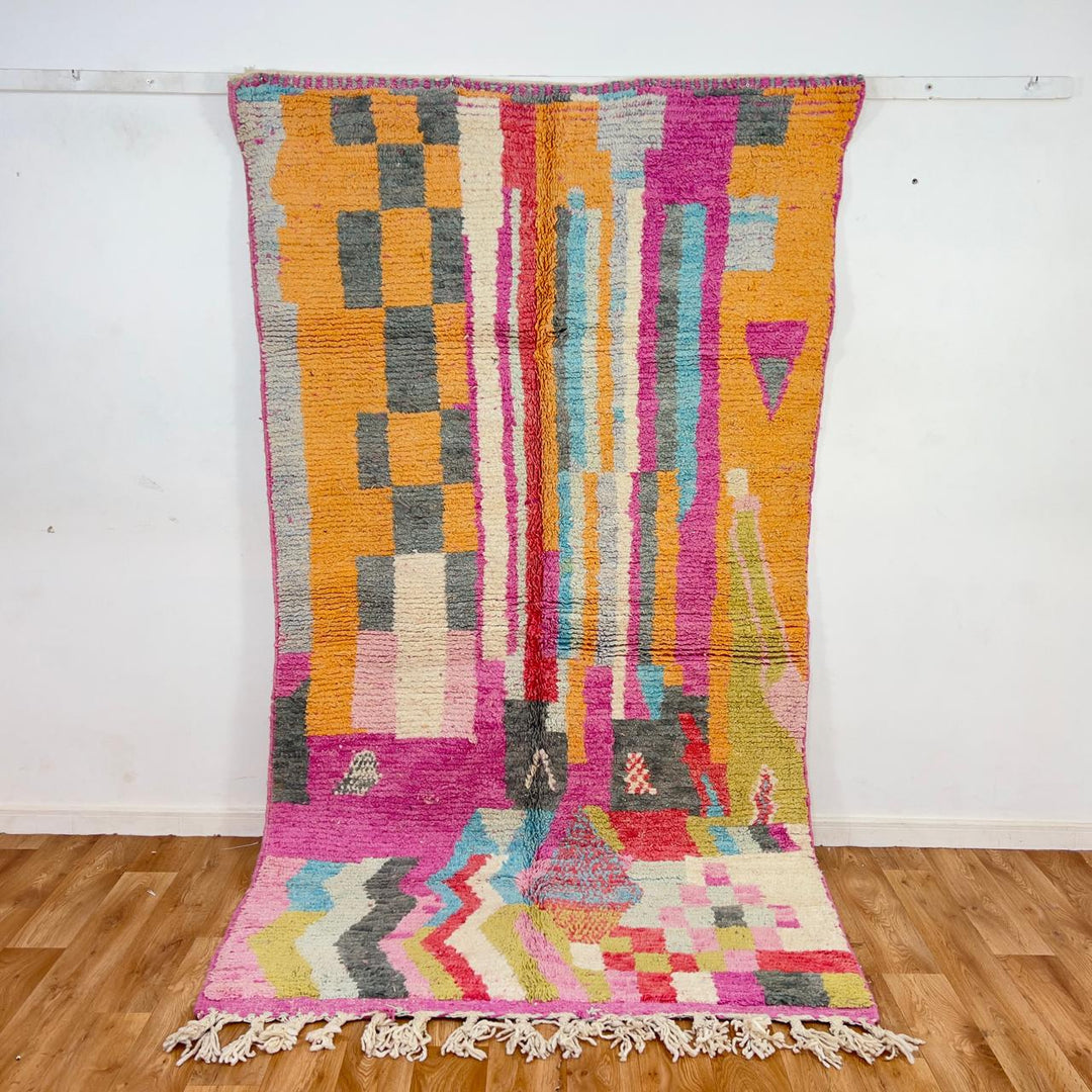 Vintage Moroccan wool rug with colorful abstract geometric pattern in pink, yellow and grey handmade Berber rug