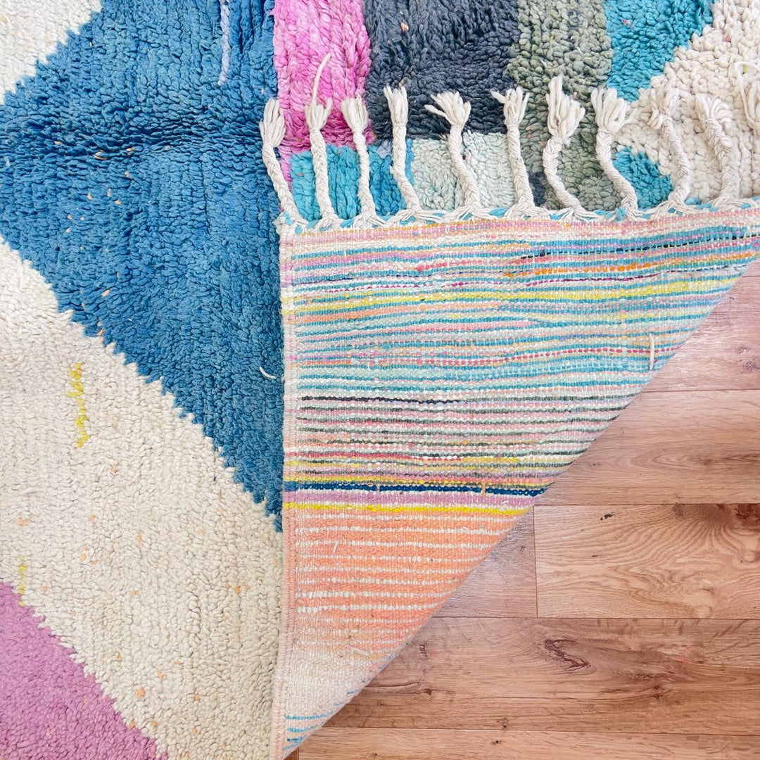 Vintage Moroccan wool rug with pastel geometric design in blue, pink, yellow and neutral tones, handmade Berber rug