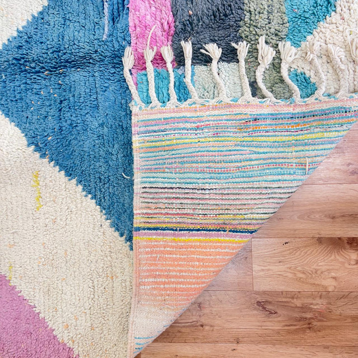 Vintage Moroccan wool rug with pastel geometric design in blue, pink, yellow and neutral tones, handmade Berber rug