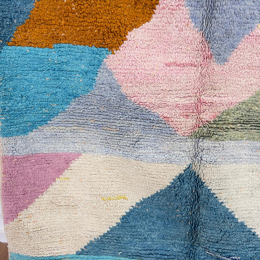Vintage Moroccan wool rug with pastel geometric design in blue, pink, yellow and neutral tones, handmade Berber rug