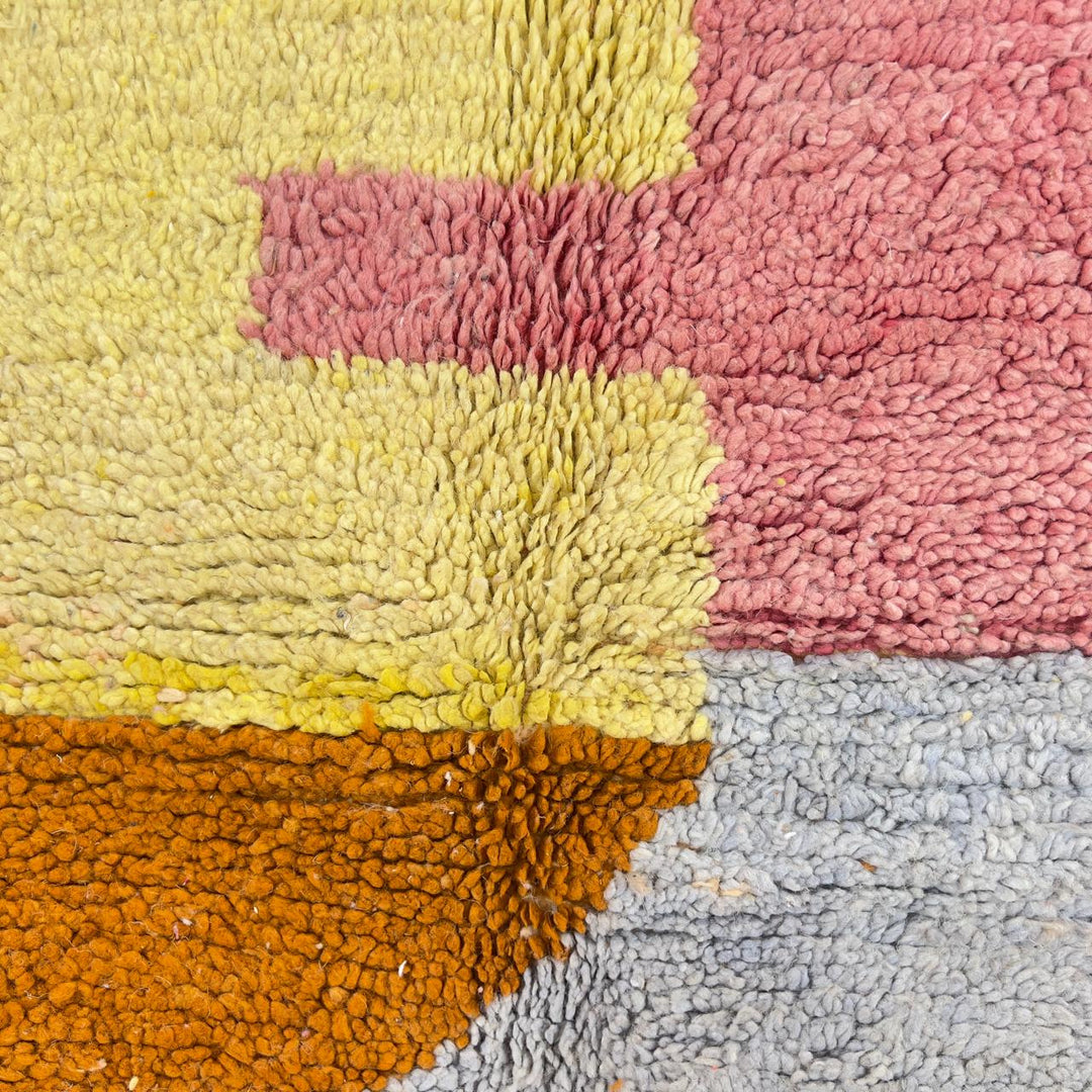 Vintage Moroccan wool rug with pastel geometric design in blue, pink, yellow and neutral tones, handmade Berber rug