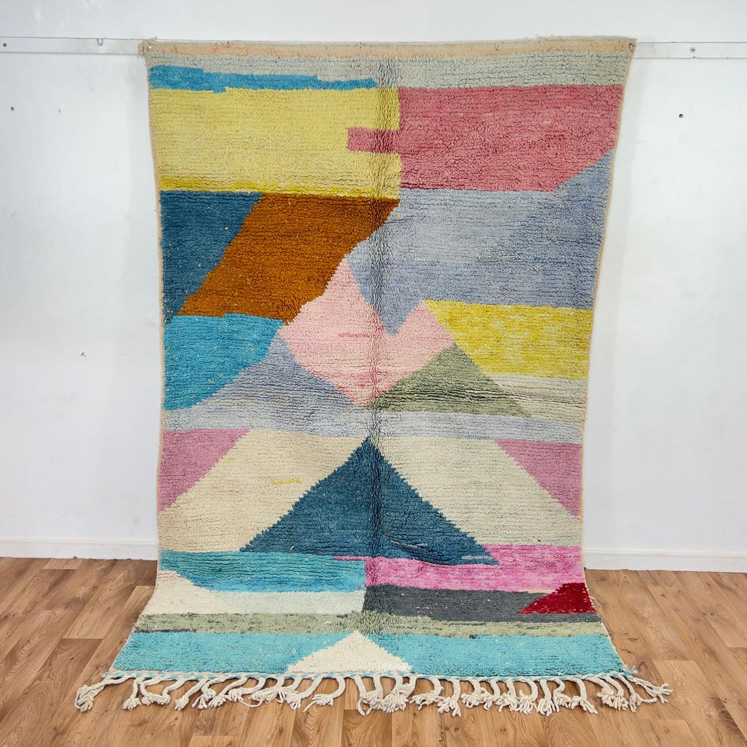 Vintage Moroccan wool rug with pastel geometric design in blue, pink, yellow and neutral tones, handmade Berber rug