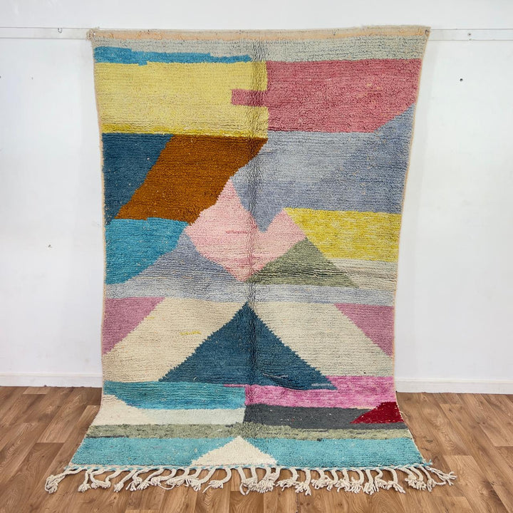 Vintage Moroccan wool rug with pastel geometric design in blue, pink, yellow and neutral tones, handmade Berber rug