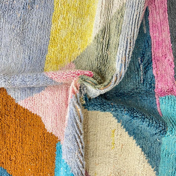 Vintage Moroccan wool rug with pastel geometric design in blue, pink, yellow and neutral tones, handmade Berber rug