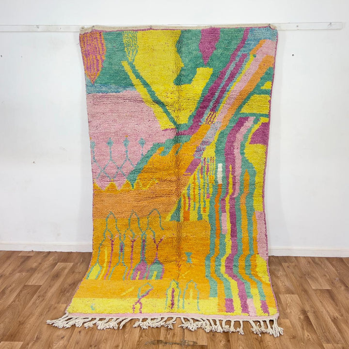 Vintage Moroccan wool rug with colorful abstract flowing design in yellow, pink and turquoise tones, handmade Berber rug