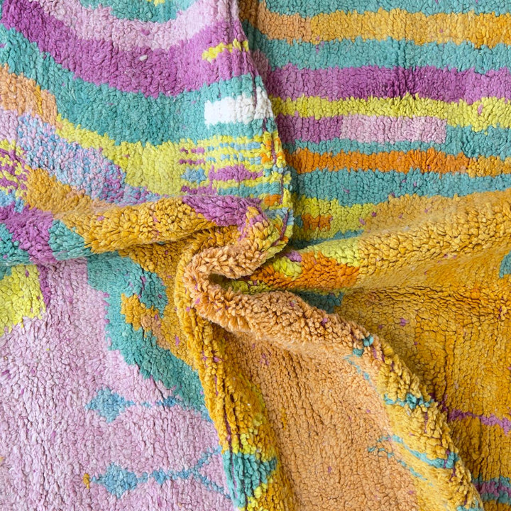 Vintage Moroccan wool rug with colorful abstract flowing design in yellow, pink and turquoise tones, handmade Berber rug