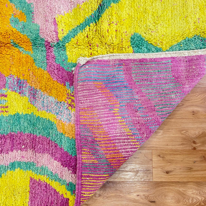 Vintage Moroccan wool rug with colorful abstract flowing design in yellow, pink and turquoise tones, handmade Berber rug