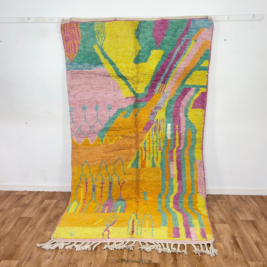 Vintage Moroccan wool rug with colorful abstract flowing design in yellow, pink and turquoise tones, handmade Berber rug