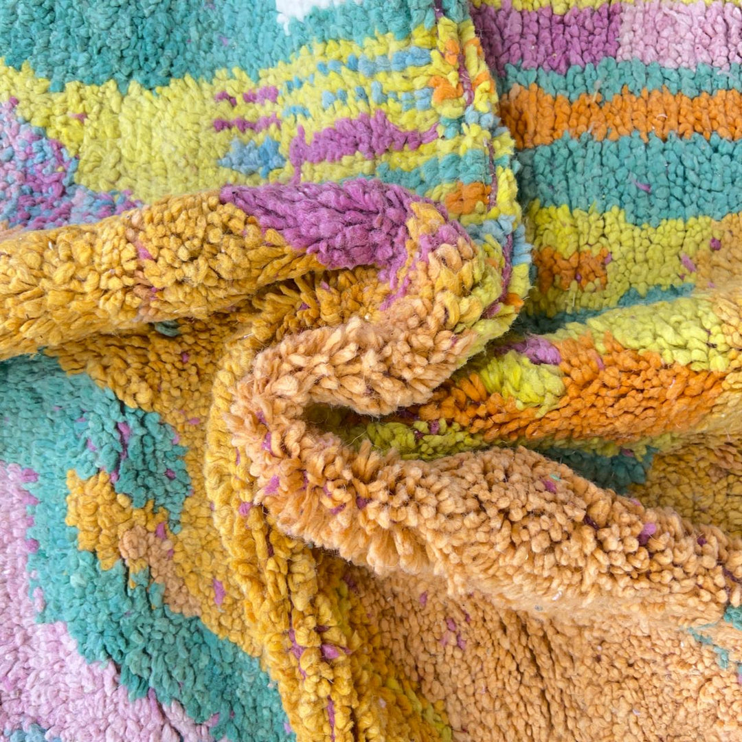 Vintage Moroccan wool rug with colorful abstract flowing design in yellow, pink and turquoise tones, handmade Berber rug