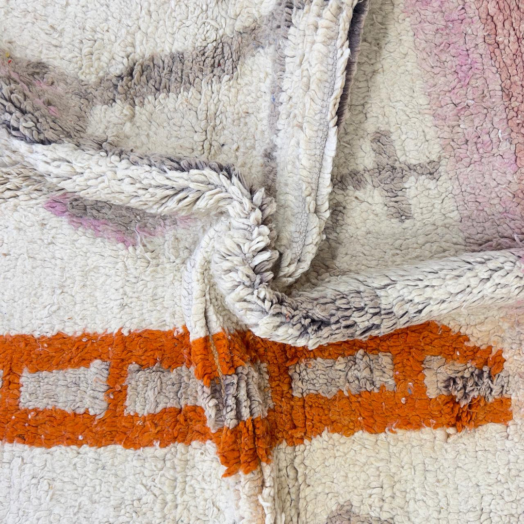 Vintage Moroccan wool rug with ivory base and orange tribal accents handmade Berber minimalist rug