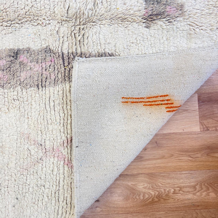 Vintage Moroccan wool rug with ivory base and orange tribal accents handmade Berber minimalist rug