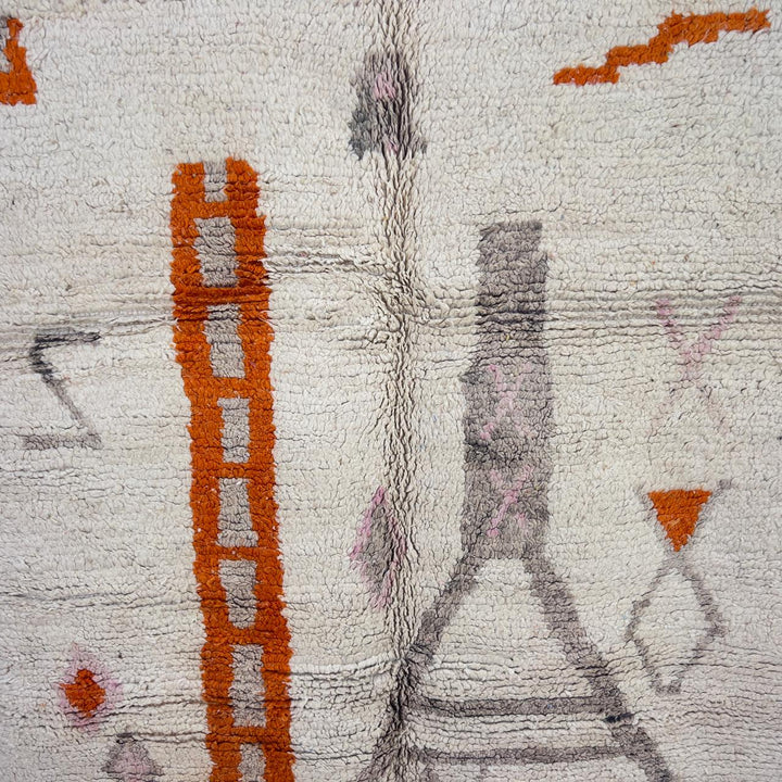 Vintage Moroccan wool rug with ivory base and orange tribal accents handmade Berber minimalist rug
