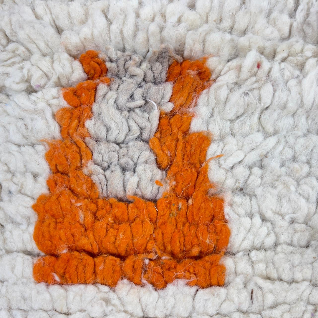 Vintage Moroccan wool rug with ivory base and orange tribal accents handmade Berber minimalist rug