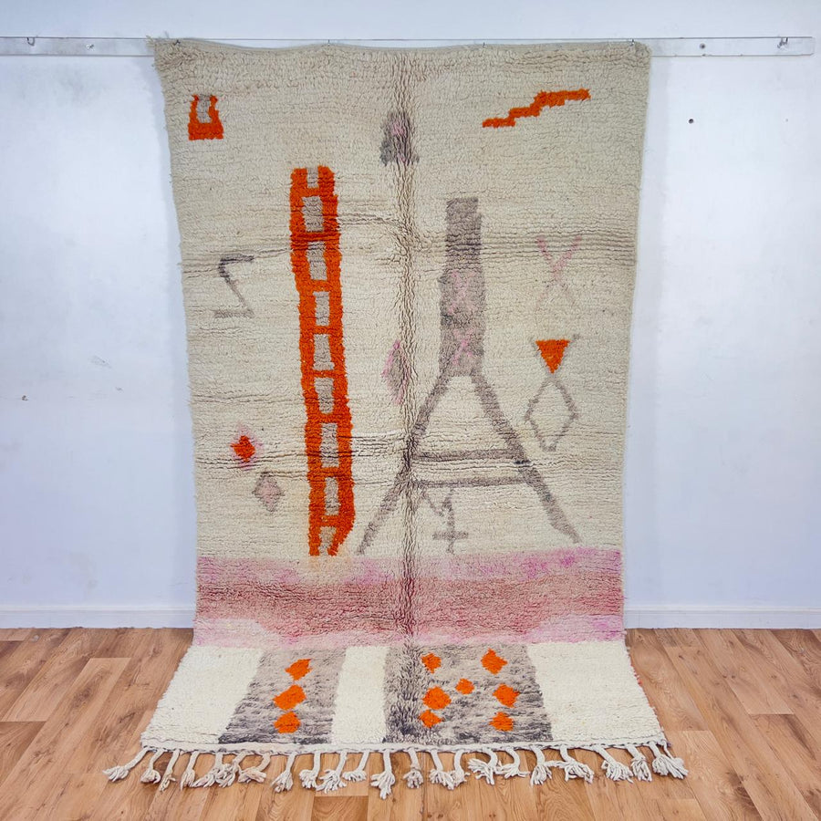 Vintage Moroccan wool rug with ivory base and orange tribal accents handmade Berber minimalist rug