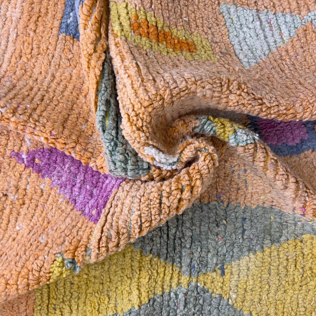Vintage Moroccan wool rug 8.0 x 5.4 ft with orange background and geometric Berber symbols in yellow purple and cream handmade rug