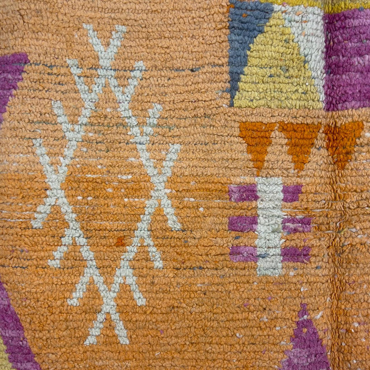 Vintage Moroccan wool rug 8.0 x 5.4 ft with orange background and geometric Berber symbols in yellow purple and cream handmade rug
