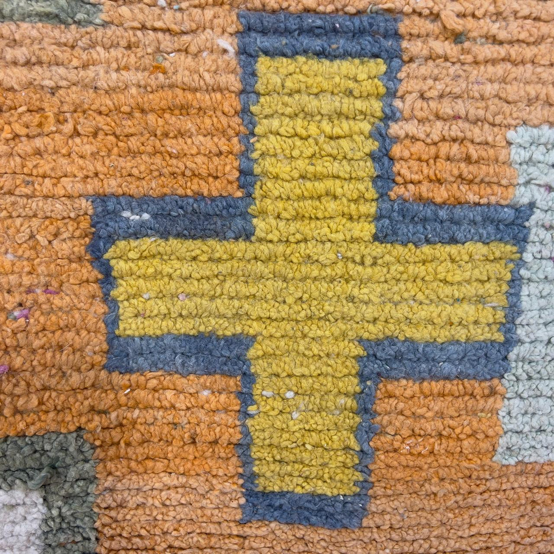 Vintage Moroccan wool rug 8.0 x 5.4 ft with orange background and geometric Berber symbols in yellow purple and cream handmade rug