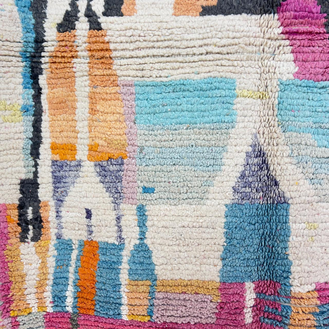 Vintage Moroccan wool rug with abstract geometric patterns in pink, blue, and yellow tones
