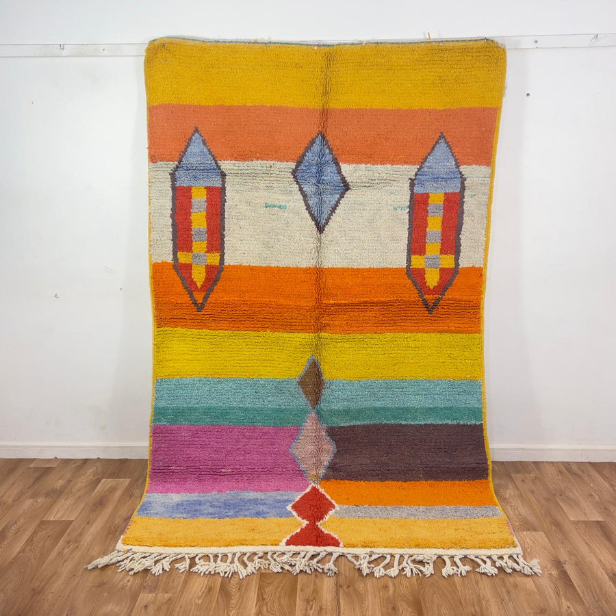 Vintage Moroccan wool rug 8.40 x 5.51 ft Rug BM1256 with colorful striped design and geometric diamond motifs in yellow, orange, pink, turquoise and earthy tones