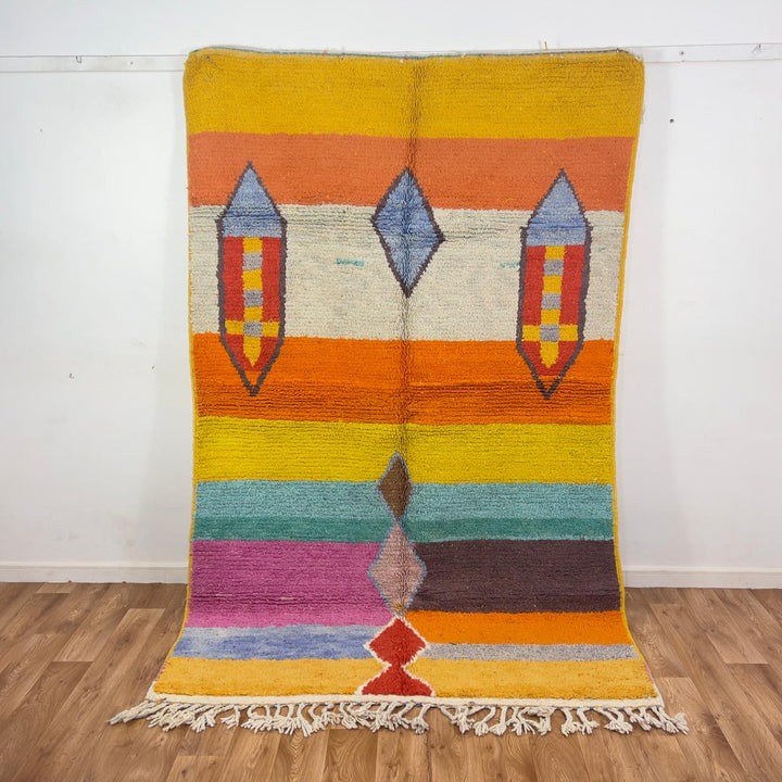 Vintage Moroccan wool rug 8.40 x 5.51 ft Rug BM1256 with colorful striped design and geometric diamond motifs in yellow, orange, pink, turquoise and earthy tones