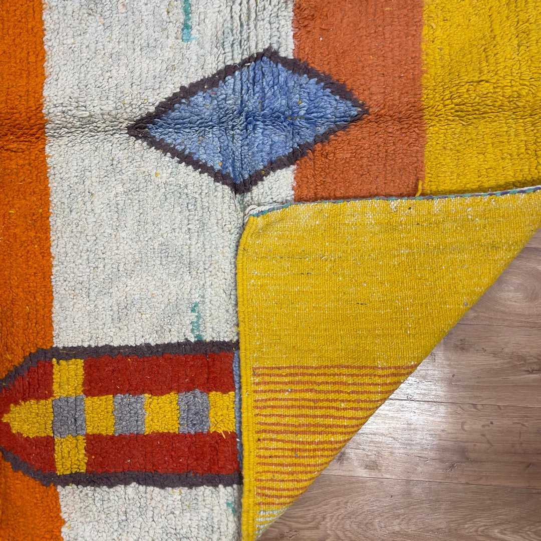 Vintage Moroccan wool rug 8.40 x 5.51 ft Rug BM1256 with colorful striped design and geometric diamond motifs in yellow, orange, pink, turquoise and earthy tones