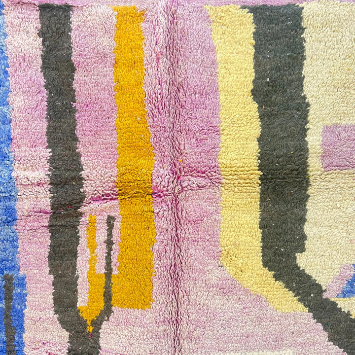 Vintage Moroccan wool rug with abstract Berber geometric shapes in blush pink, teal, mustard and ivory, handmade in Morocco.