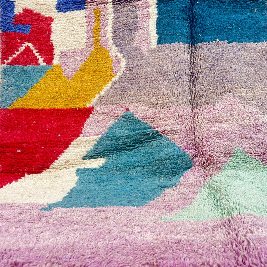 Vintage Moroccan wool rug with abstract Berber geometric shapes in blush pink, teal, mustard and ivory, handmade in Morocco.