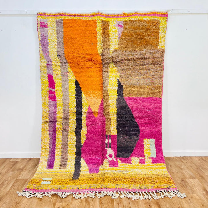 Handmade vintage Moroccan wool rug in pink and yellow with abstract Berber design. One-of-a-kind artisan rug, 255×166 cm.